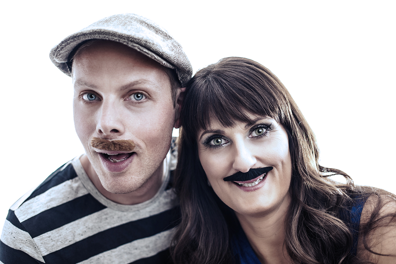 Man and woman who have mustaches on their face.